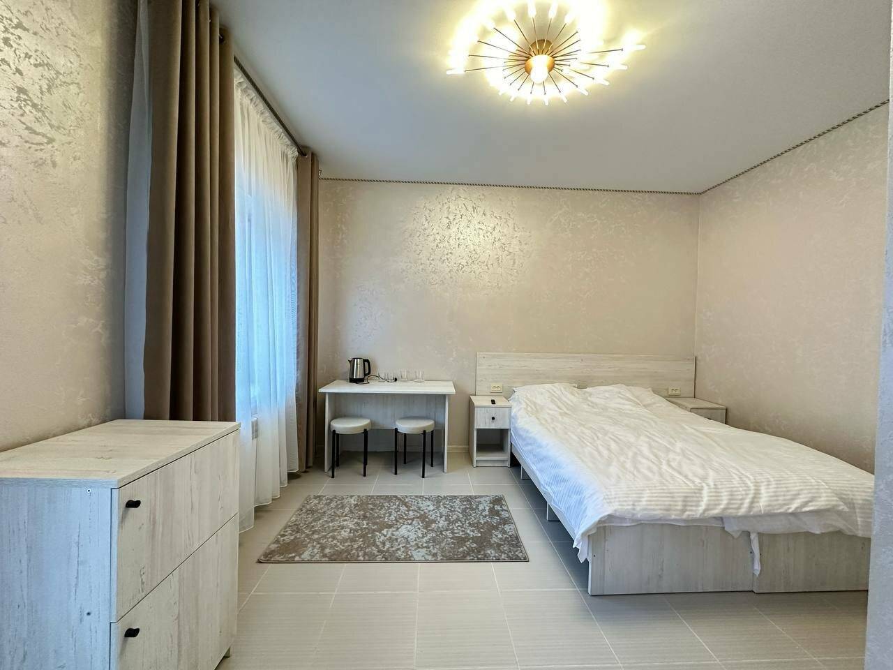 Фотографии номера Двухместный номер-студия Делюкс с 1 кроватью в Гостинице Лесная Сказка Домбай